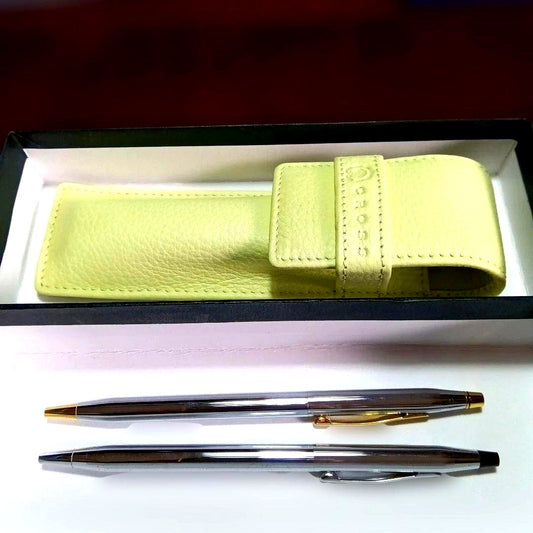 Cross Classic Century two-piece ballpoint pen set with black and blue refills displayed with a brown leather case