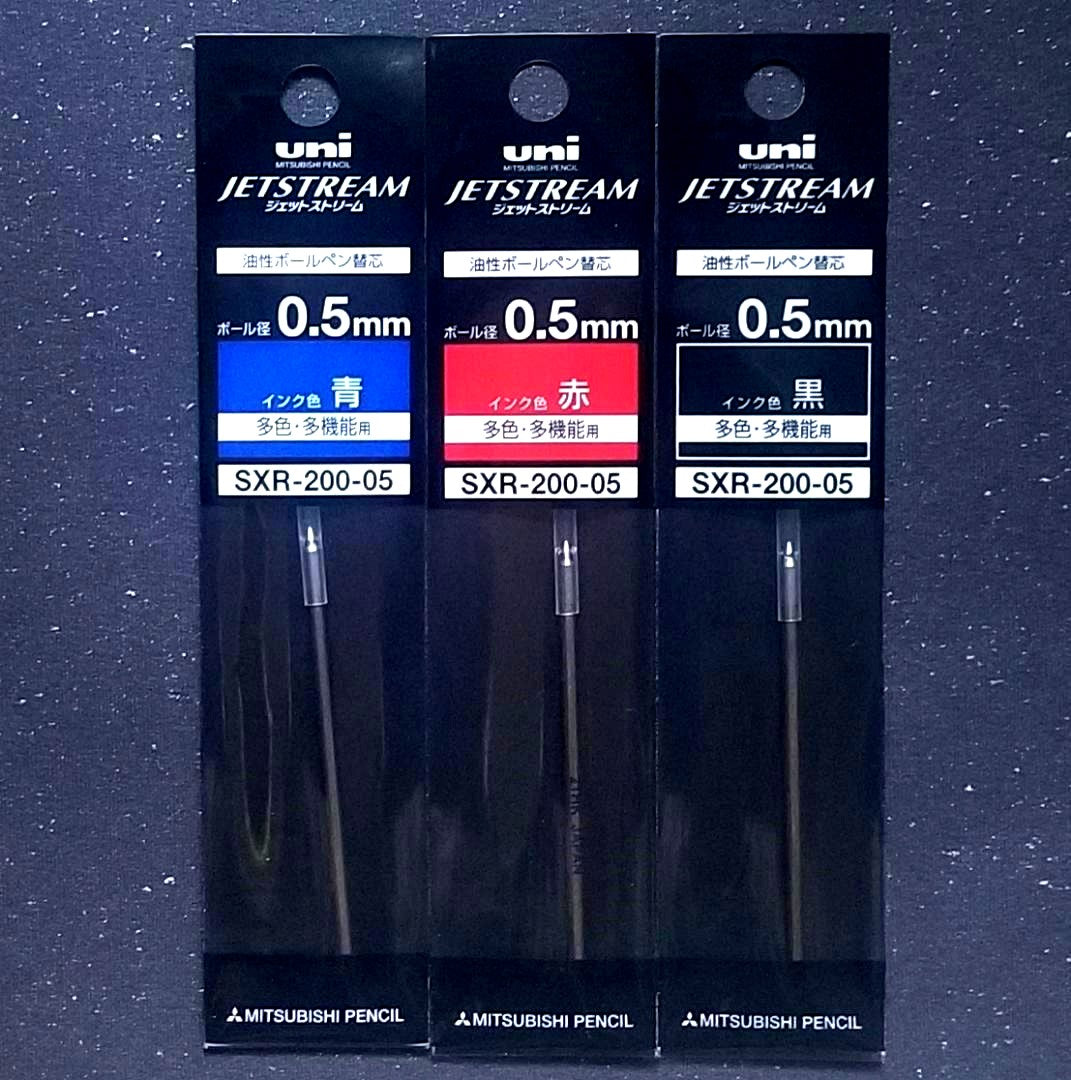 Three Pilot Jetstream 0.5mm multi-function pen refills in black, red, and blue with metal tips