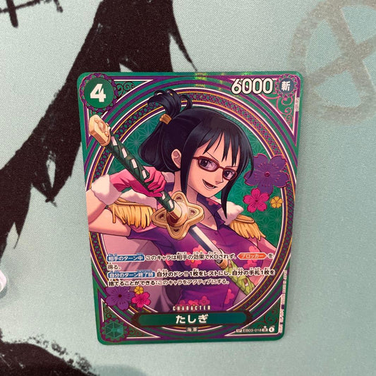One Piece Tashigi SP EB03-018 collectible card displayed in protective sleeve