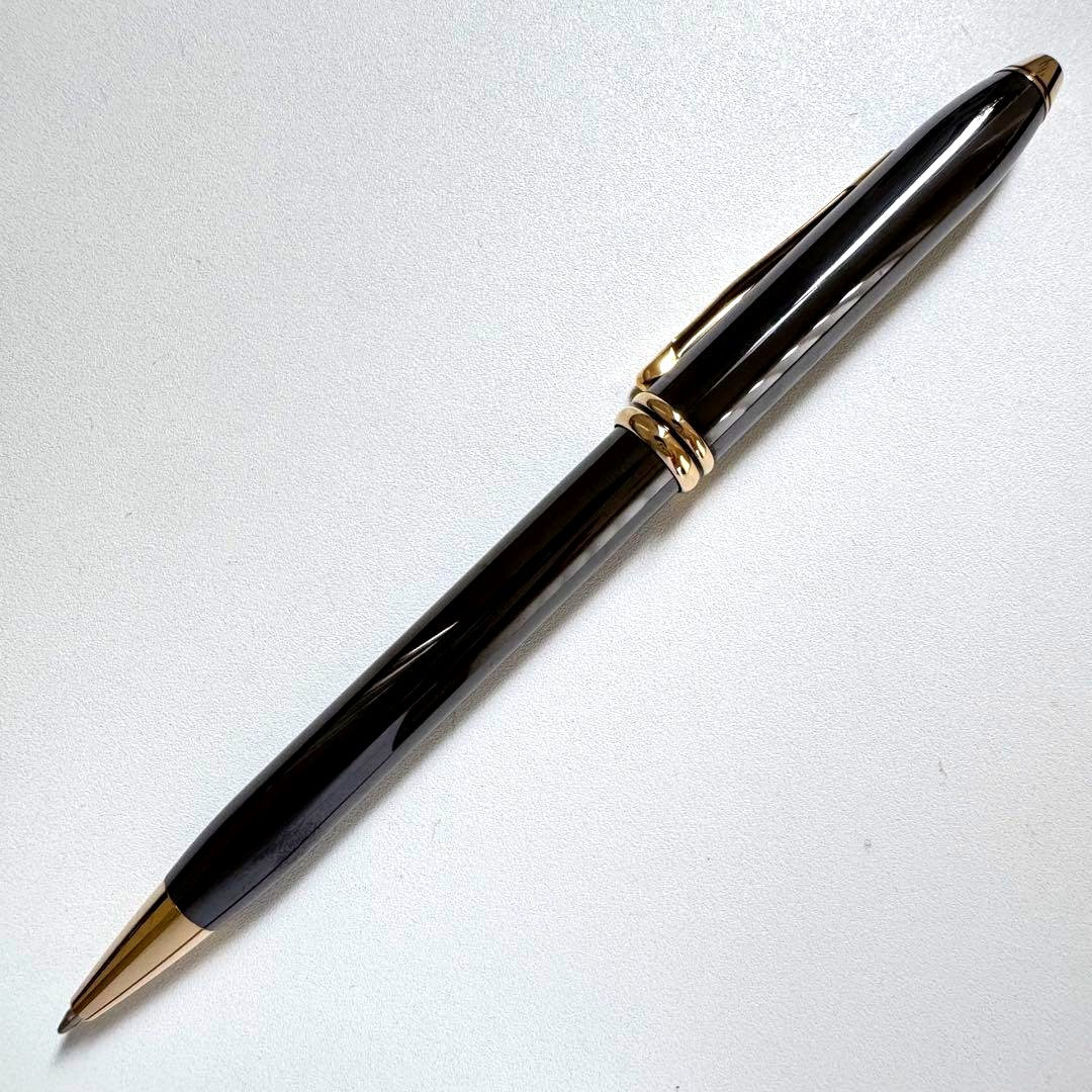 Vintage Cross Townsend gold titanium ballpoint pen with twist mechanism and worn condition