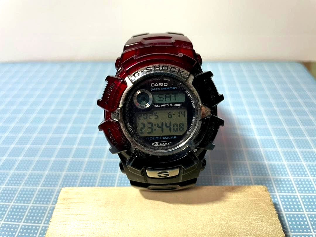 Casio G-Shock digital watch Model 2184 with black and red colors and digital display featuring touch solar function