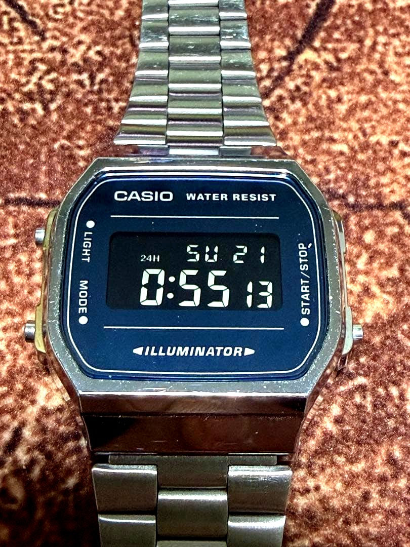 Casio A168WE digital watch body in dark blue with classic design and Illuminator backlight