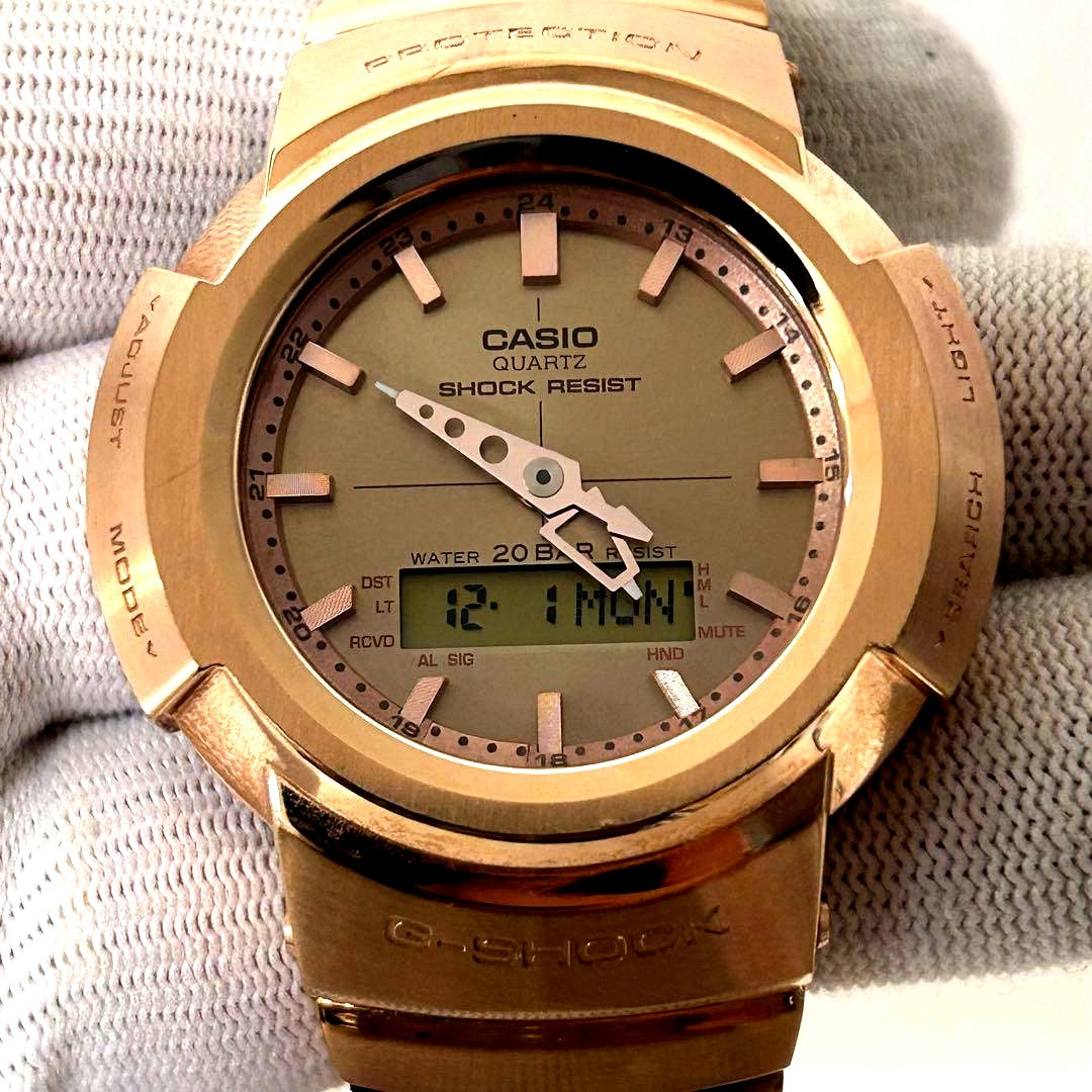 Used Casio G-Shock AWM-500GD watch with digital display and scratched band