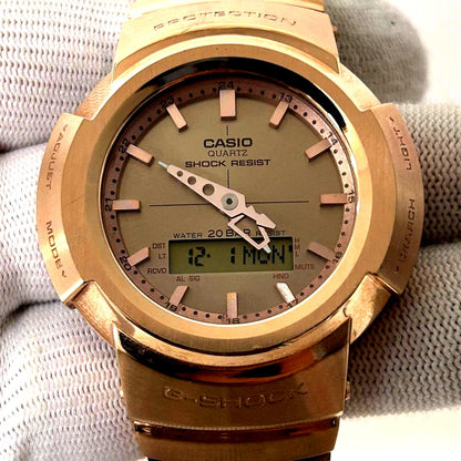 Used Casio G-Shock AWM-500GD watch with digital display and scratched band