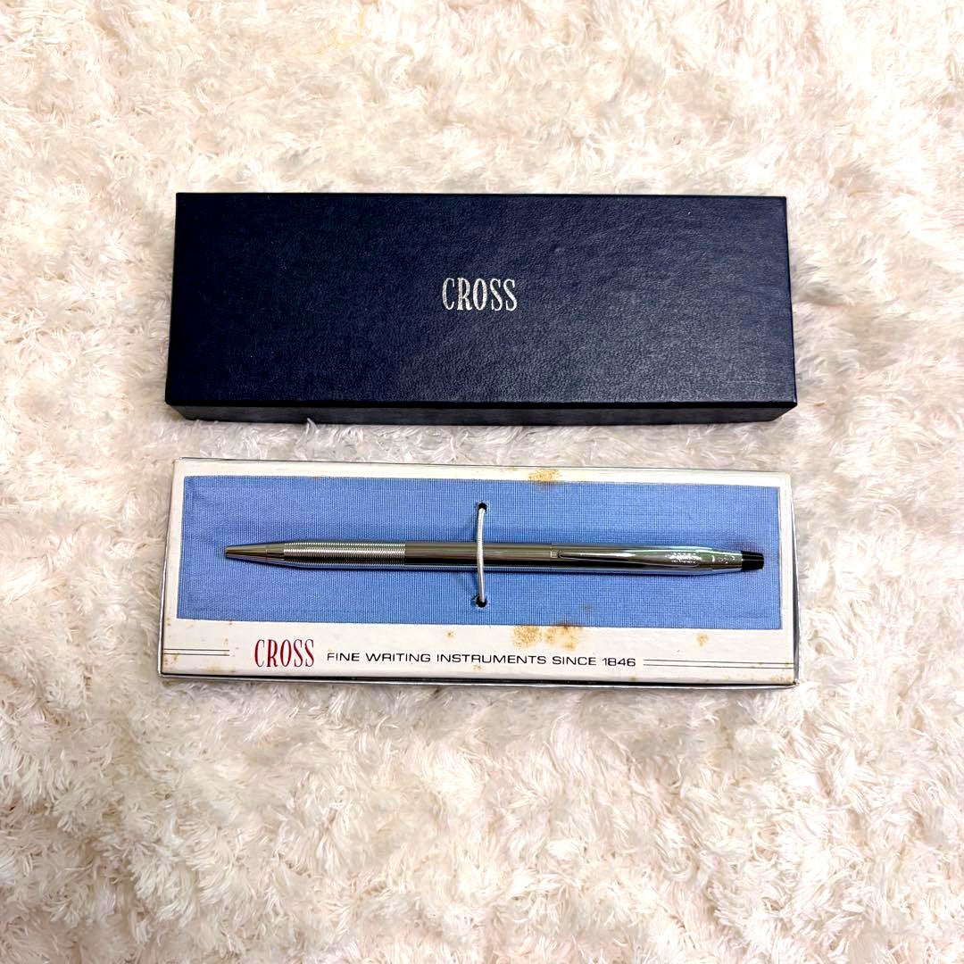 CROSS gold ballpoint pen with gold body and included box showing signs of storage wear
