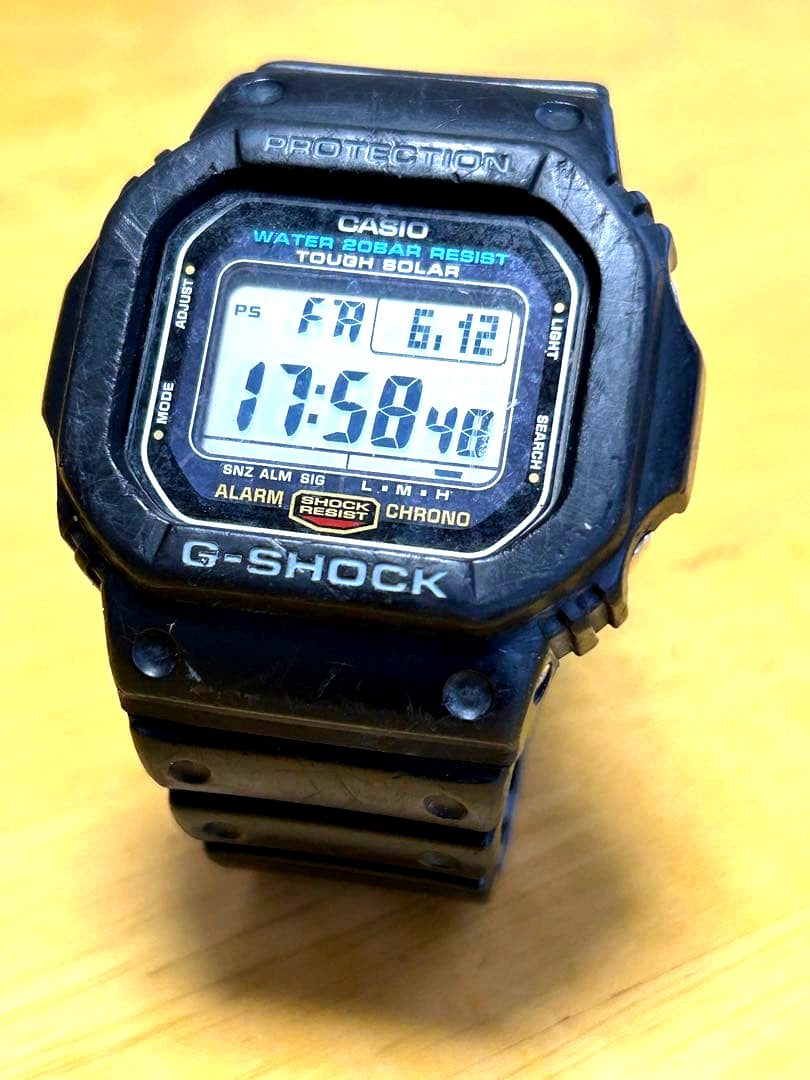 Casio G-Shock G-5600E watch module 3160 with visible signs of use and scratches on glass