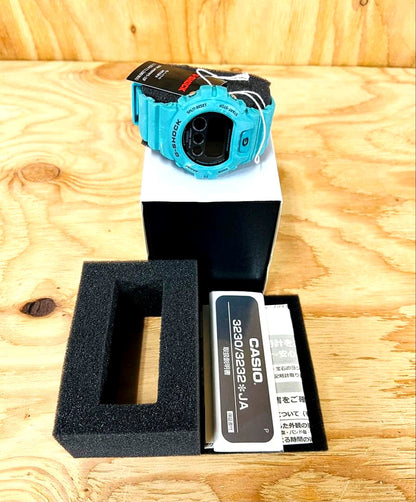 Casio G-Shock DW-6900WS-2JF watch with turquoise blue color, front view