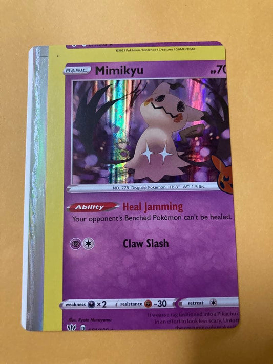 Mimikyu Japanese trading card with large vertical and horizontal cutting error from overseas edition