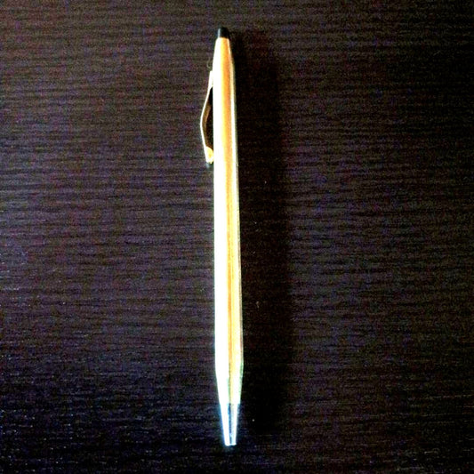 Cross brand gold color twist-operated ballpoint pen with slim sleek design
