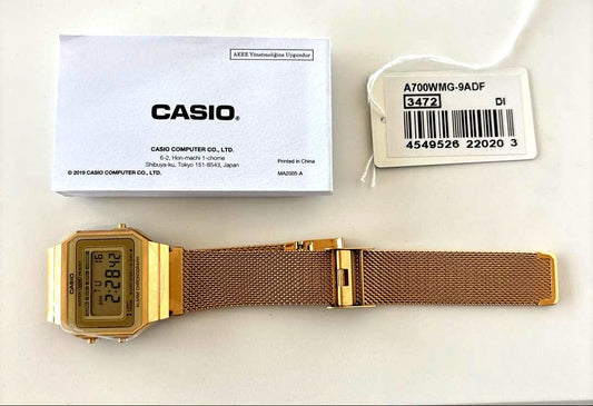 Casio A700WMG-9A digital watch with gold LCD display and stainless steel band