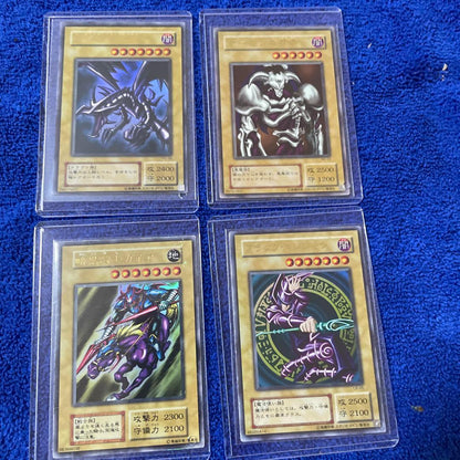 Bandai Yu-Gi-Oh Ultra Rare trading card set featuring Dark Magician, Dark Ghael, Red-Eyes Black Dragon, Summoned Demon