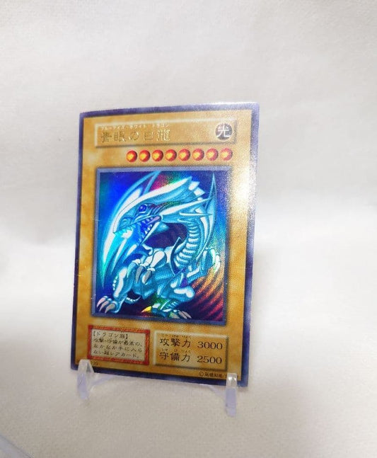Yugioh Blue-Eyes White Dragon Early Ultra Rare trading card in protective sleeve and hard case