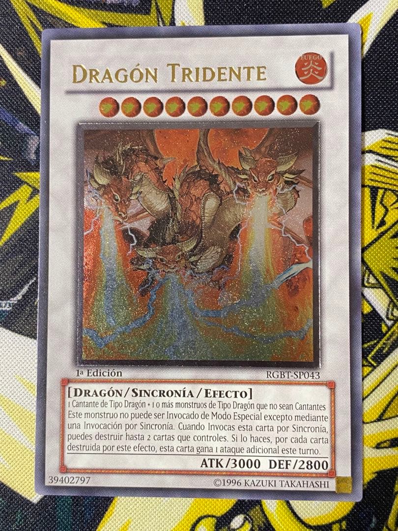 Trident Dragion Yu-Gi-Oh Spanish Relief 1st Edition card in play condition with minor scratches and chips