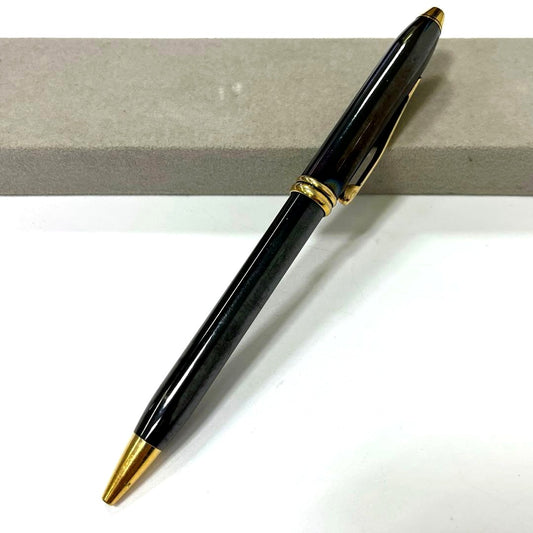 Used Cross Twist Style black and gold ballpoint pen with black ink and slight wear marks
