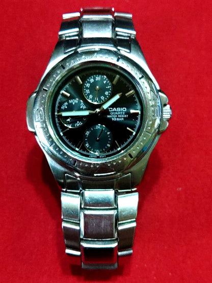 Casio MTD-1046 analog quartz watch with black dial and silver bezel, 10 BAR water resistance