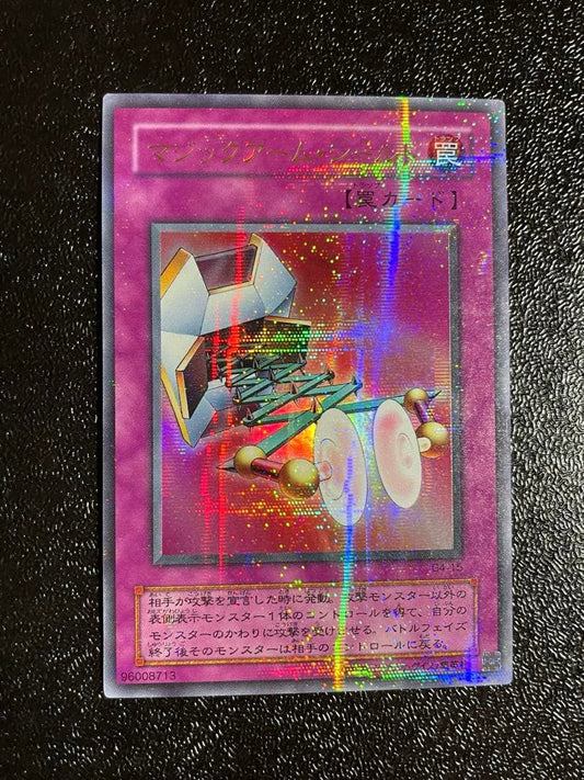 Yugi-Oh Magic Arm Shield Parallel Rare trading card with slight corner peeling and minor back scratches