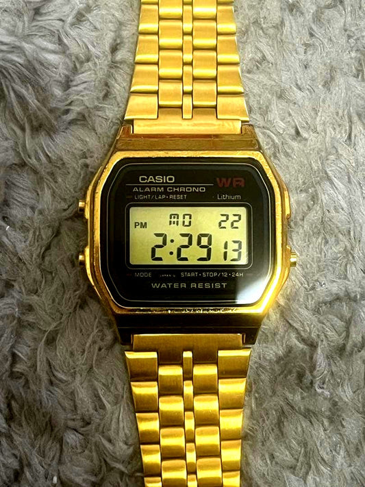 Casio Alarm Chrono gold digital wristwatch with mesh band and water resistant design