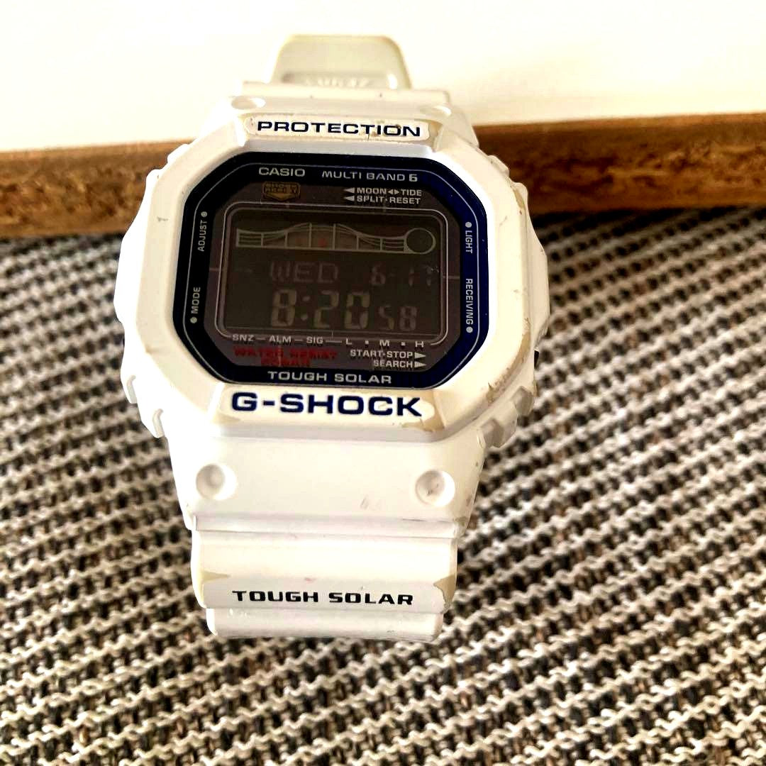 Casio G-Shock G-Lide GWX-5600C solar digital watch with tide graph and moon data, showing minor signs of use