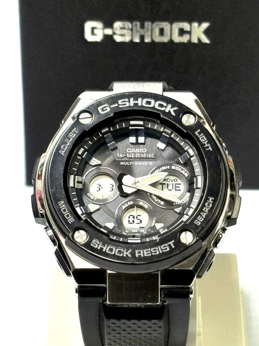 Casio G-Shock GST-W300G-1AJF watch with resin bezel and stainless steel case, displayed with box and manual