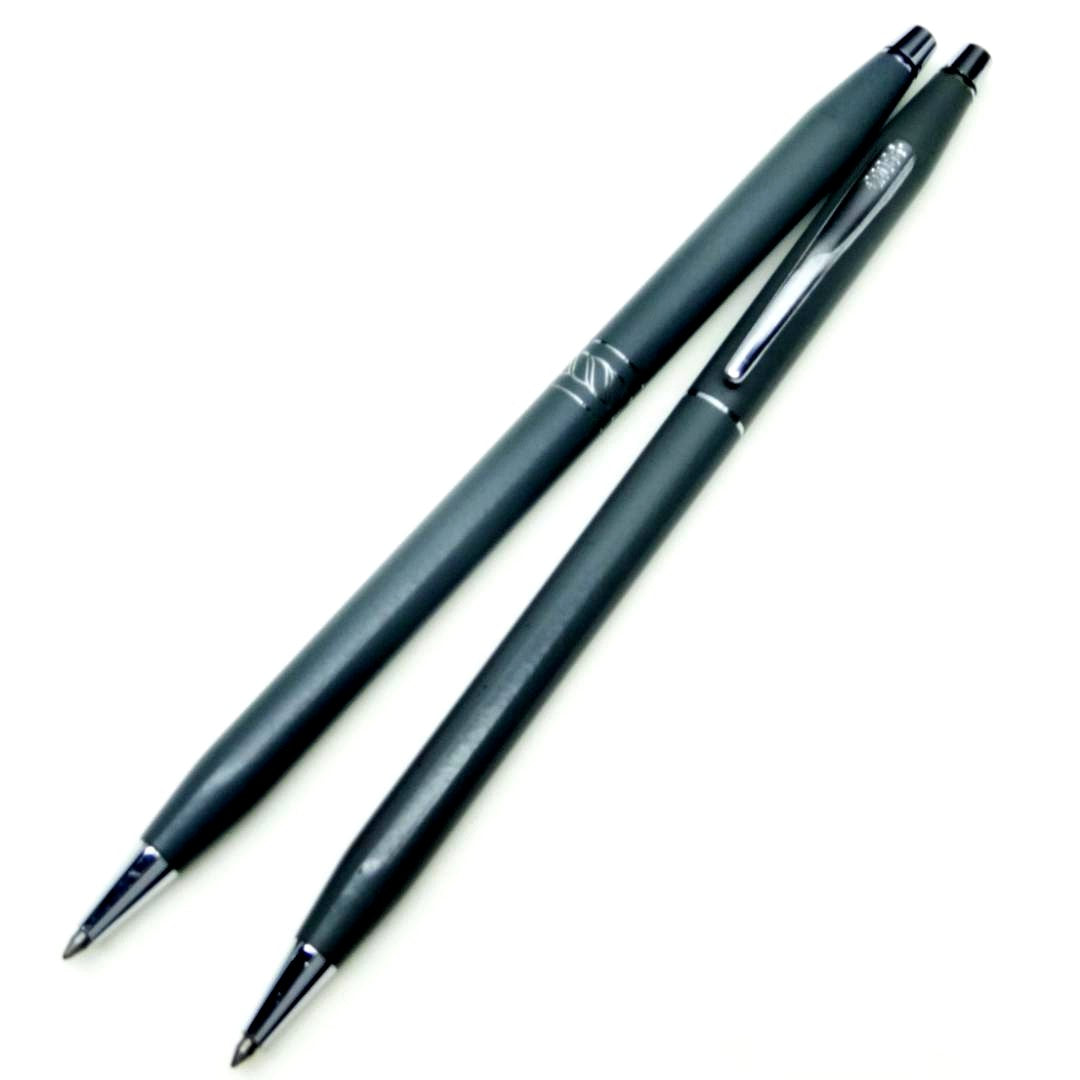 Two Cross gray twist-type ballpoint pens with black and blue ink in metal body, set of 2 pieces