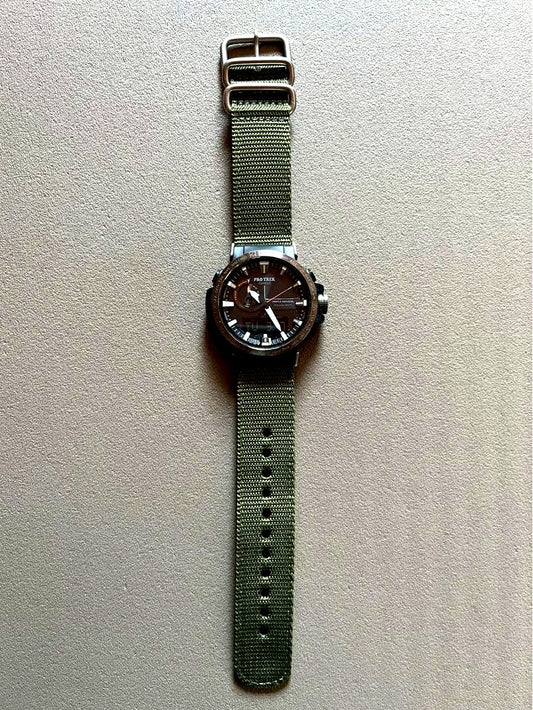 Casio Pro Trek PRW-60Y wristwatch with black dial and exchange band showing minor scratch on bezel