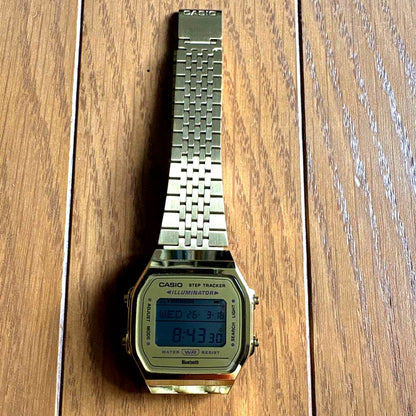 Casio ABL-100WEG-9A digital Bluetooth watch in gold with stainless steel and resin strap