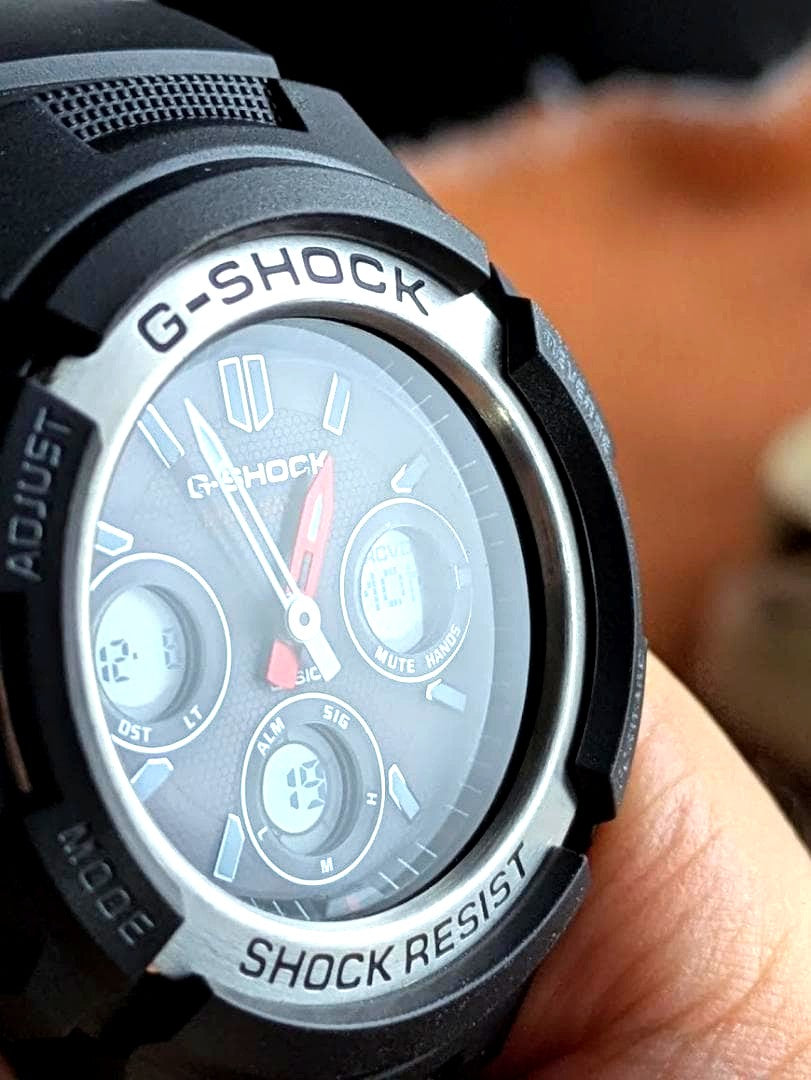 Casio G-Shock AWG-M100 solar atomic watch with black bezel and strap, showing clean crystal and stainless steel back
