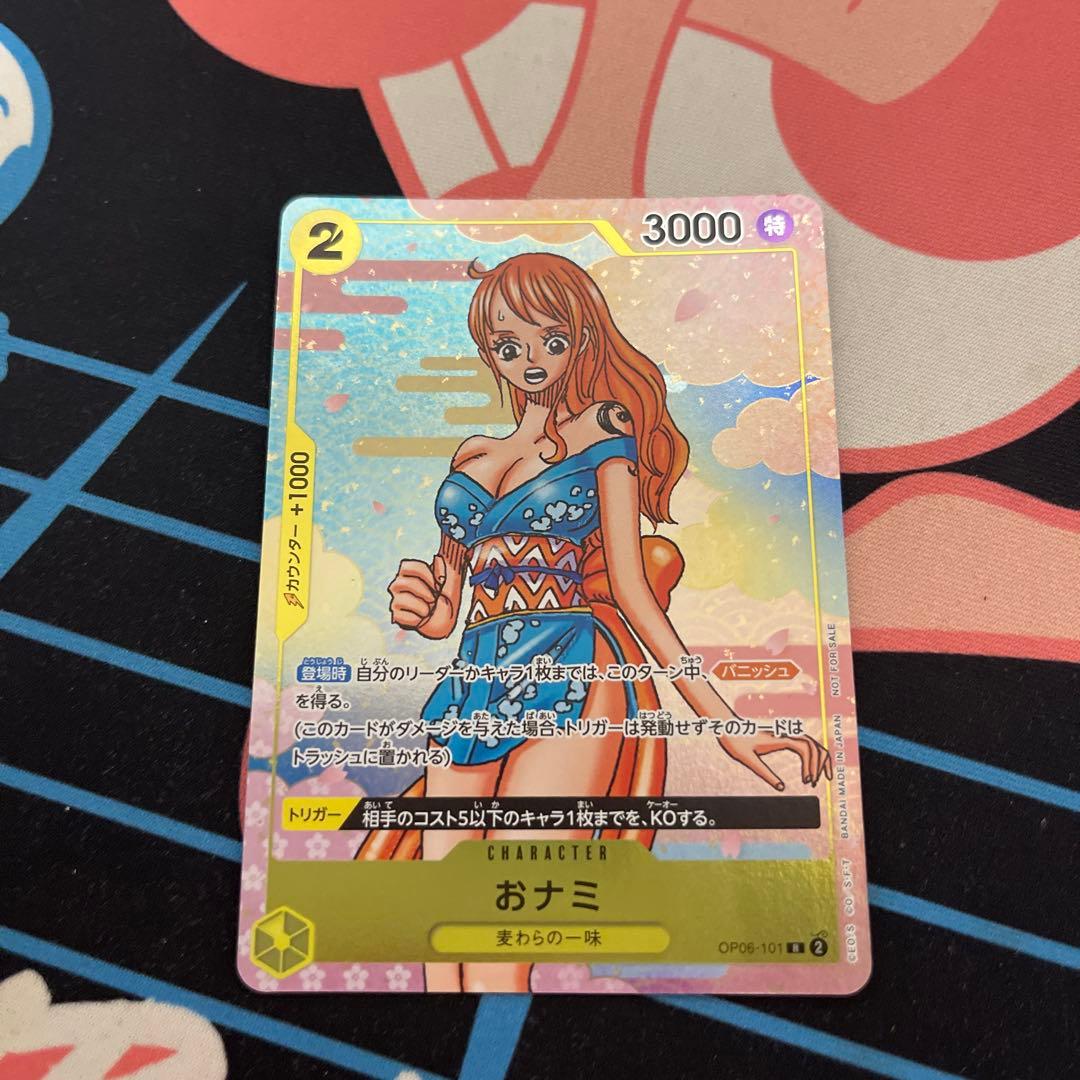 One Piece Official Card Game character card featuring Nami with model number OP06-101