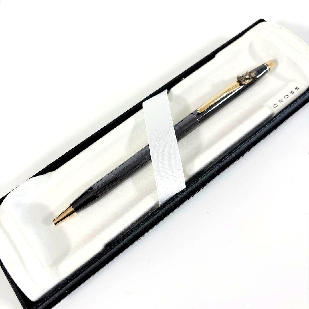 Cross Mickey ballpoint pen with black and gold design featuring Mickey Mouse figure, slight tarnish visible