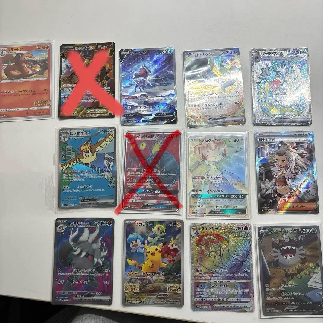 Collection of retired Pokemon cards with signs of storage wear arranged on a flat surface