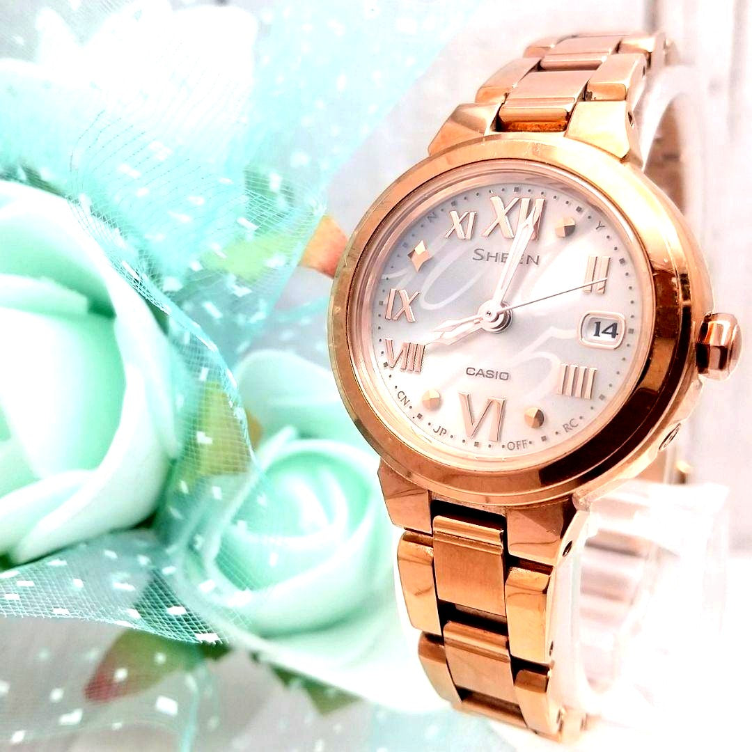 Casio Radio Solar women's wristwatch model D17001 with metal band, Roman numeral dial, and date feature