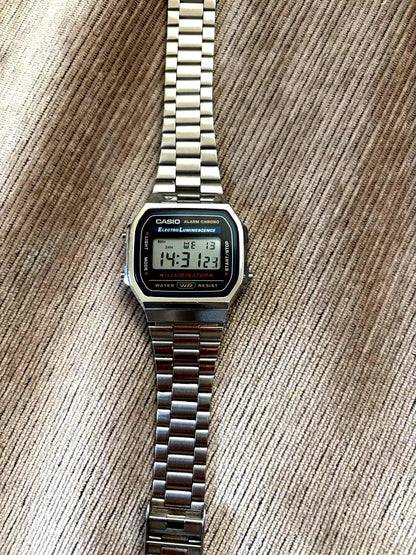 Casio Digital Watch with stainless steel case, backlight, alarm, and stopwatch features