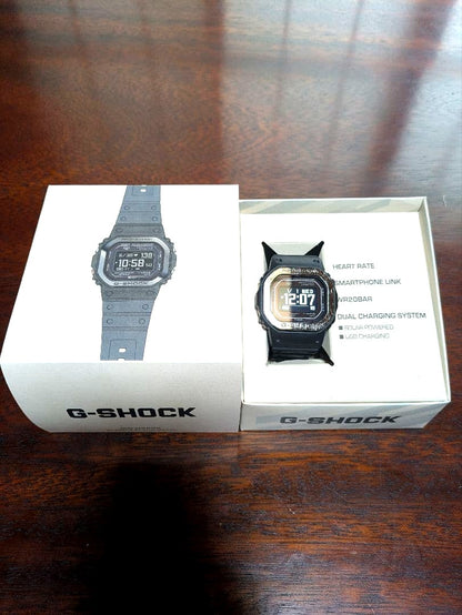 Casio G-Squad Series DW-H5600 digital watch with black bezel and digital display showing time