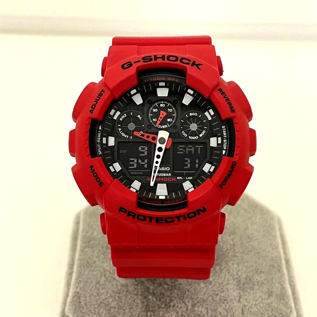 Used Casio G-Shock GA-100B analog digital men's watch with black case and strap showing signs of use