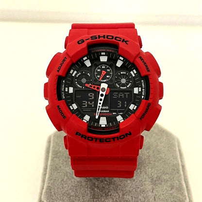 Used Casio G-Shock GA-100B analog digital men's watch with black case and strap showing signs of use