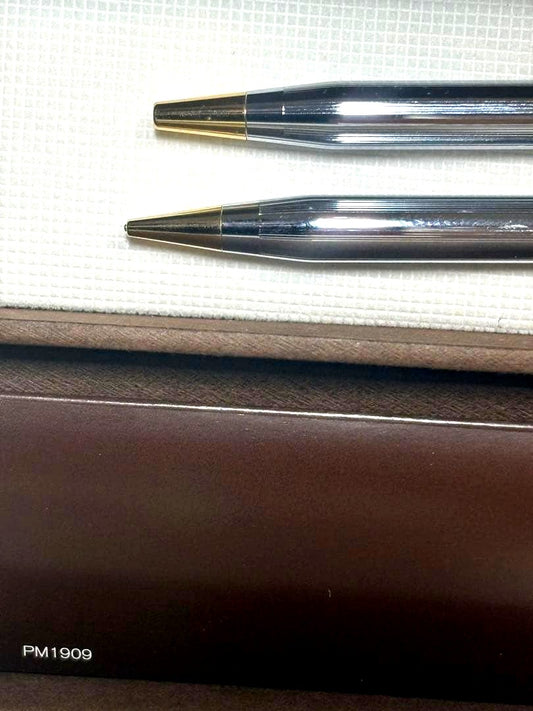 Cross Classic Century rotating push-button ballpoint pen and mechanical pencil set with silver and gold accents in a presentation case