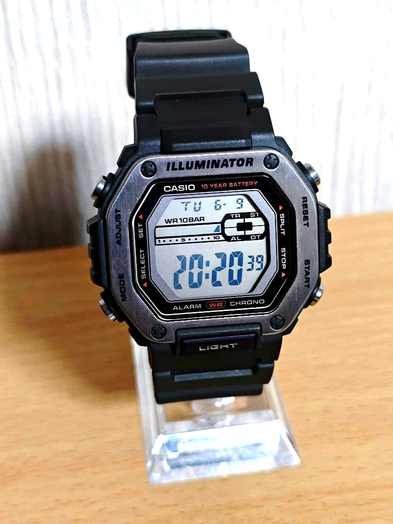 Casio WD-110H digital watch with black rugged design and digital display, showing time and functions