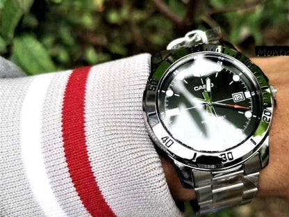 Casio Analog Watch with large black dial, silver stainless steel band, and 22mm lug width
