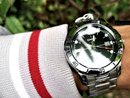 Casio Analog Watch with large black dial, silver stainless steel band, and 22mm lug width