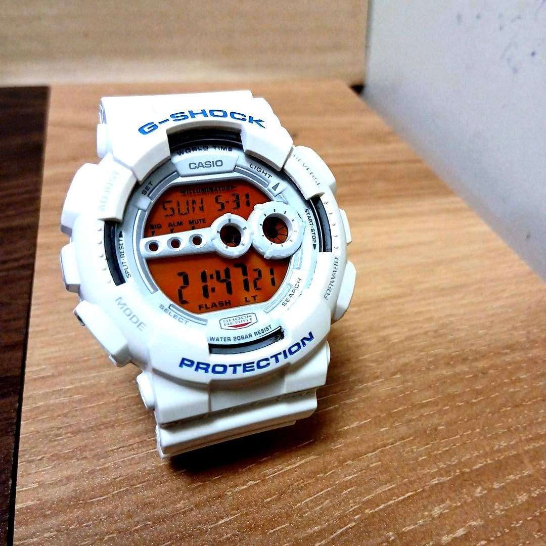 Casio G-Shock GD-100SC men's digital watch with white and orange LCD from Crazy Colors Series