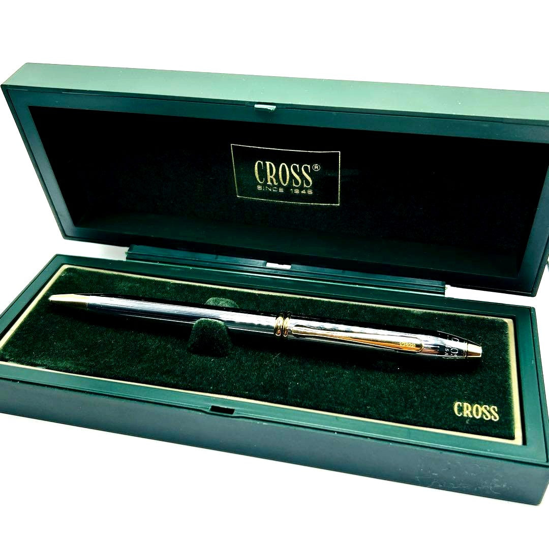 Cross Twist Ballpoint Pen with glossy silver body and gold accents, shown with dedicated case