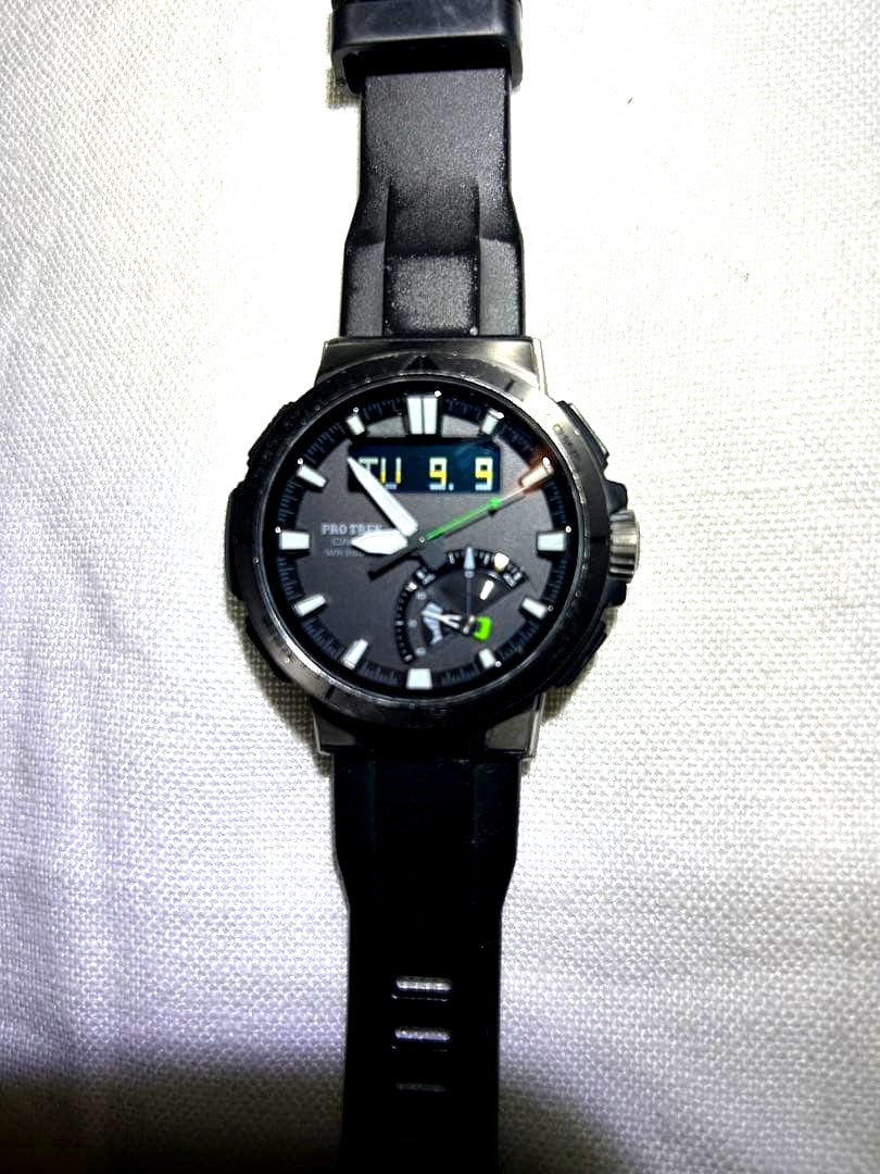 Casio Pro Trek PRW-70Y watch with engraved back, showing used condition and digital analog display
