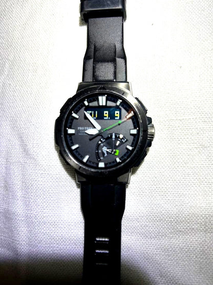 Casio Pro Trek PRW-70Y watch with engraved back, showing used condition and digital analog display
