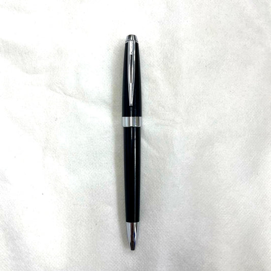 Used Cross black ballpoint pen with scratches and wear, compact size 0.4-0.6 inches wide and 1.6 inches high