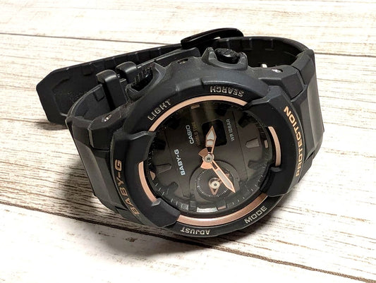 Casio Baby-G women's watch in black with rose gold accents and resin band featuring analog and digital display