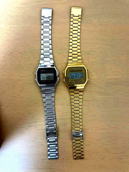 Casio digital wristwatch set showing silver and gold digital watches with alarm and chronograph features
