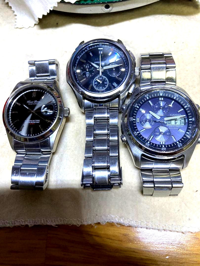 Set of three stainless steel quartz watches from Kentex, Seiko, and Casio with differing bands and visible wear
