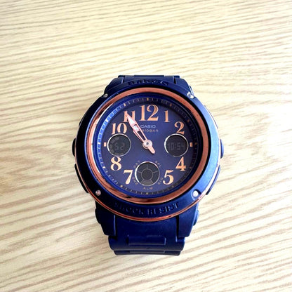 Casio Baby-G BGA-150PG-2B2JF navy band watch with gold dial showing main display