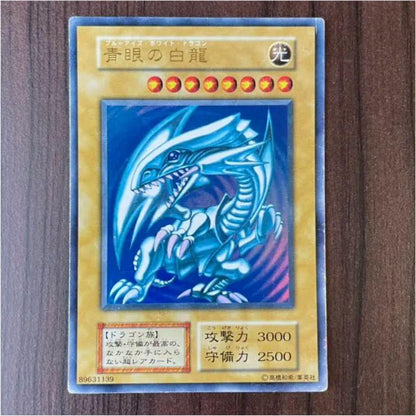 Ultra Rare Early Version Blue-Eyes White Dragon Yugioh card with Starter Box and protective sleeves