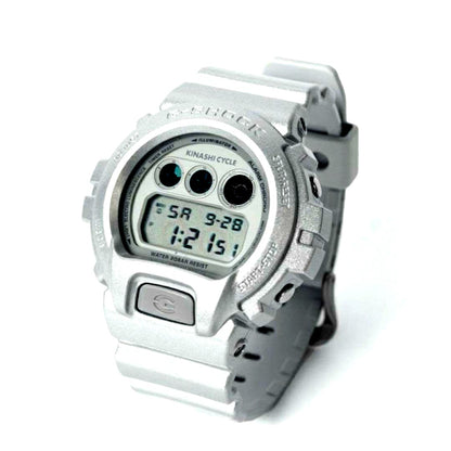 Casio G-Shock Kinashi Cycle Edition silver collaboration watch with bicycle logo and digital display